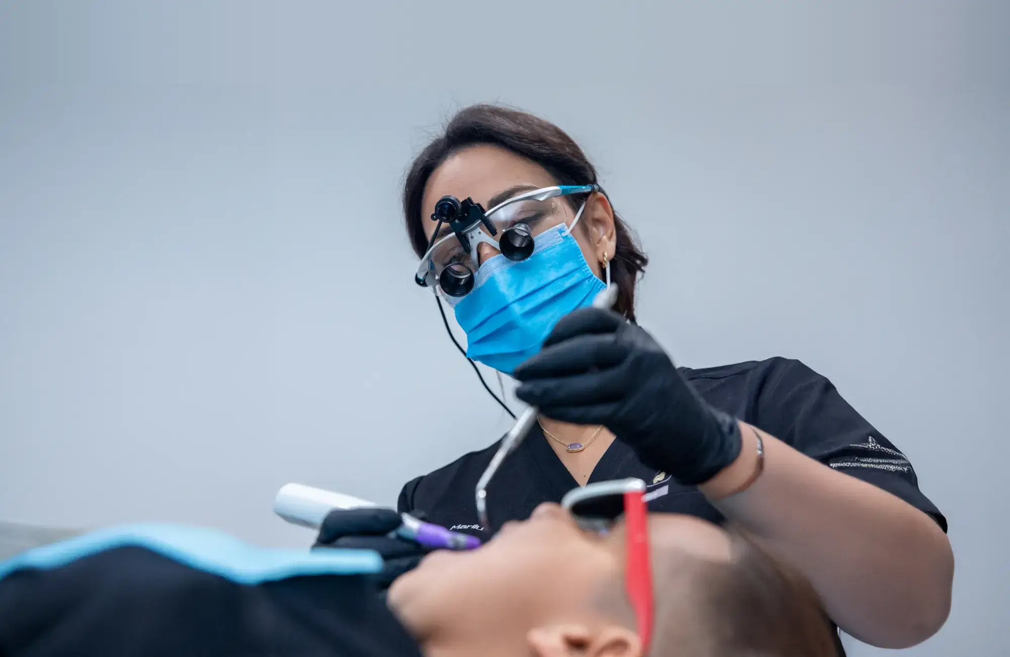 Dentist performing a dental checkup at Charming Smiles of Ocoee