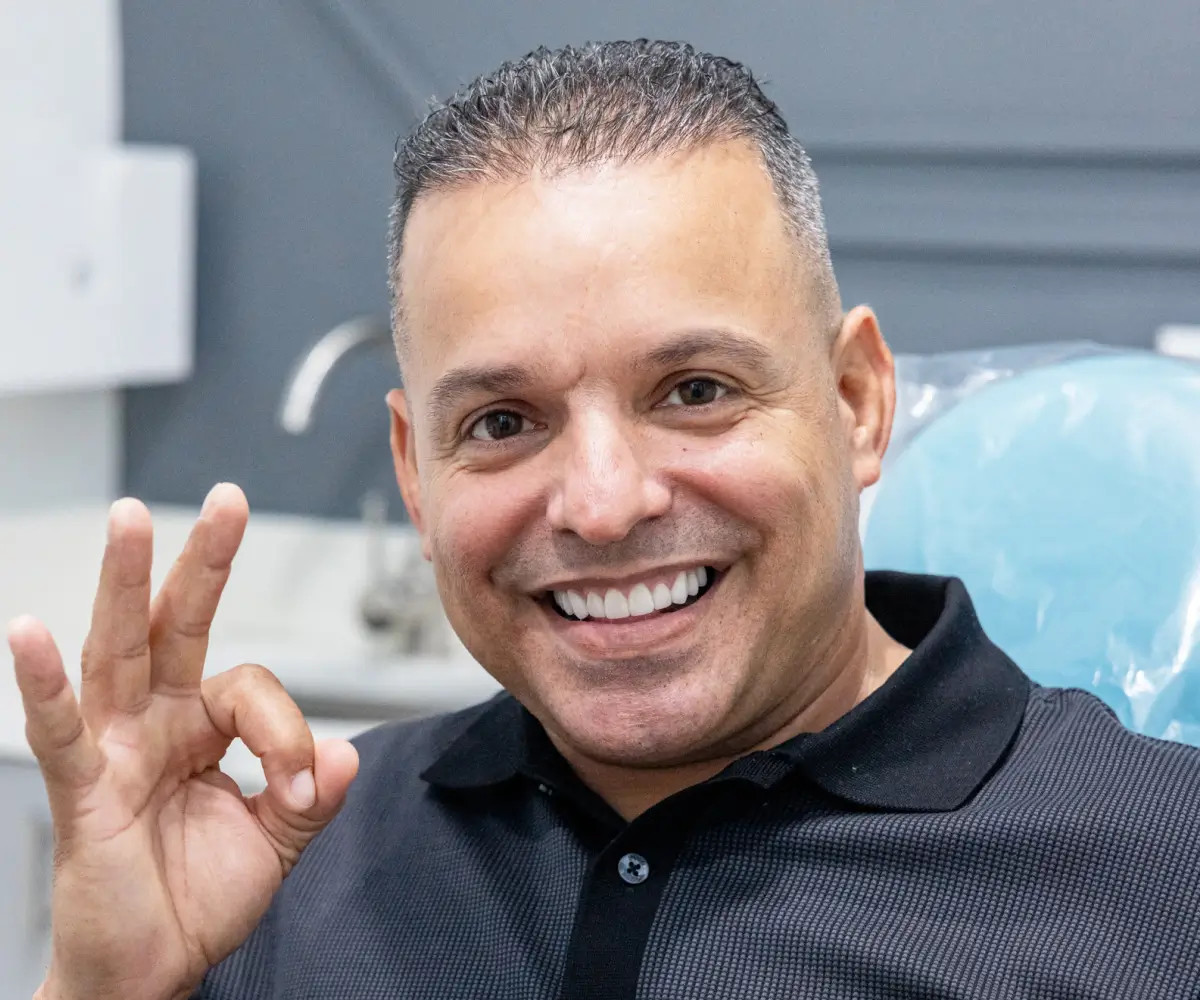 Smiling patient after dental checkup at Charming Smiles of Ocoee