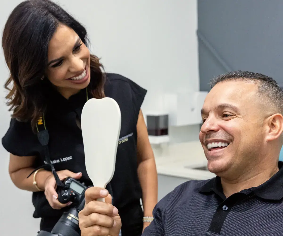 Happy patient leaving Charming Smiles of Ocoee with a bright smile