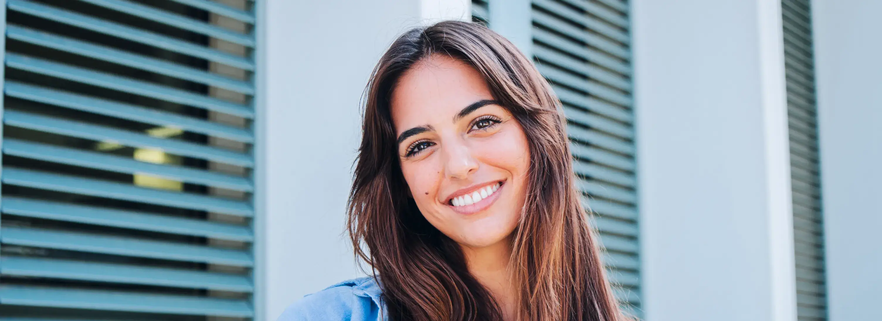 Smiling woman after cosmetic dentistry at Charming Smiles of Ocoee