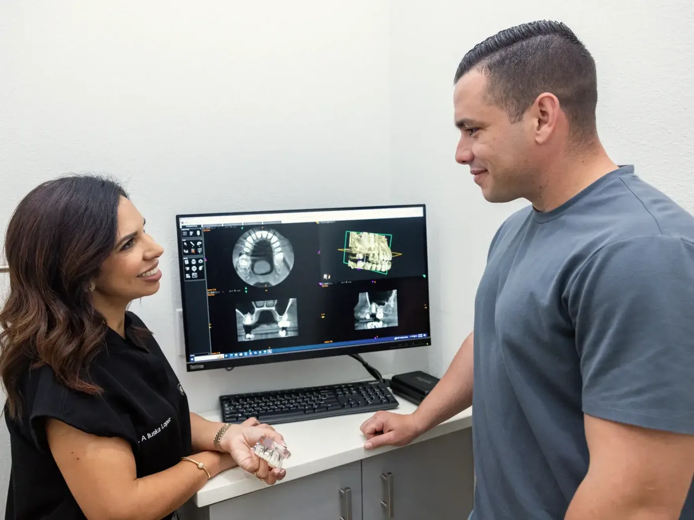 Dentist discussing tooth extraction options with a patient