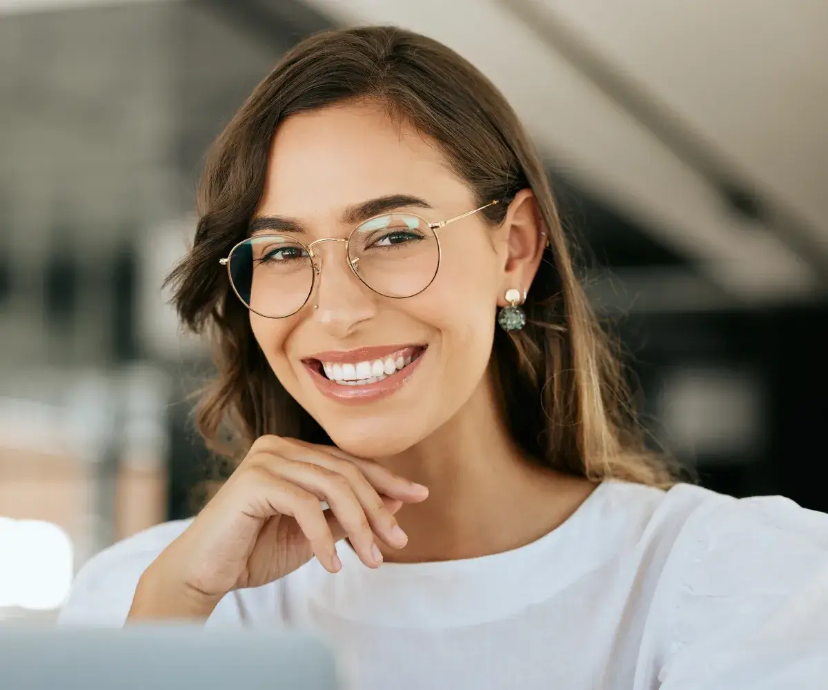 Patient smiling confidently after veneer placement